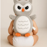 Baby wearing Pink Uv owl head protector cushion while crawling indoors